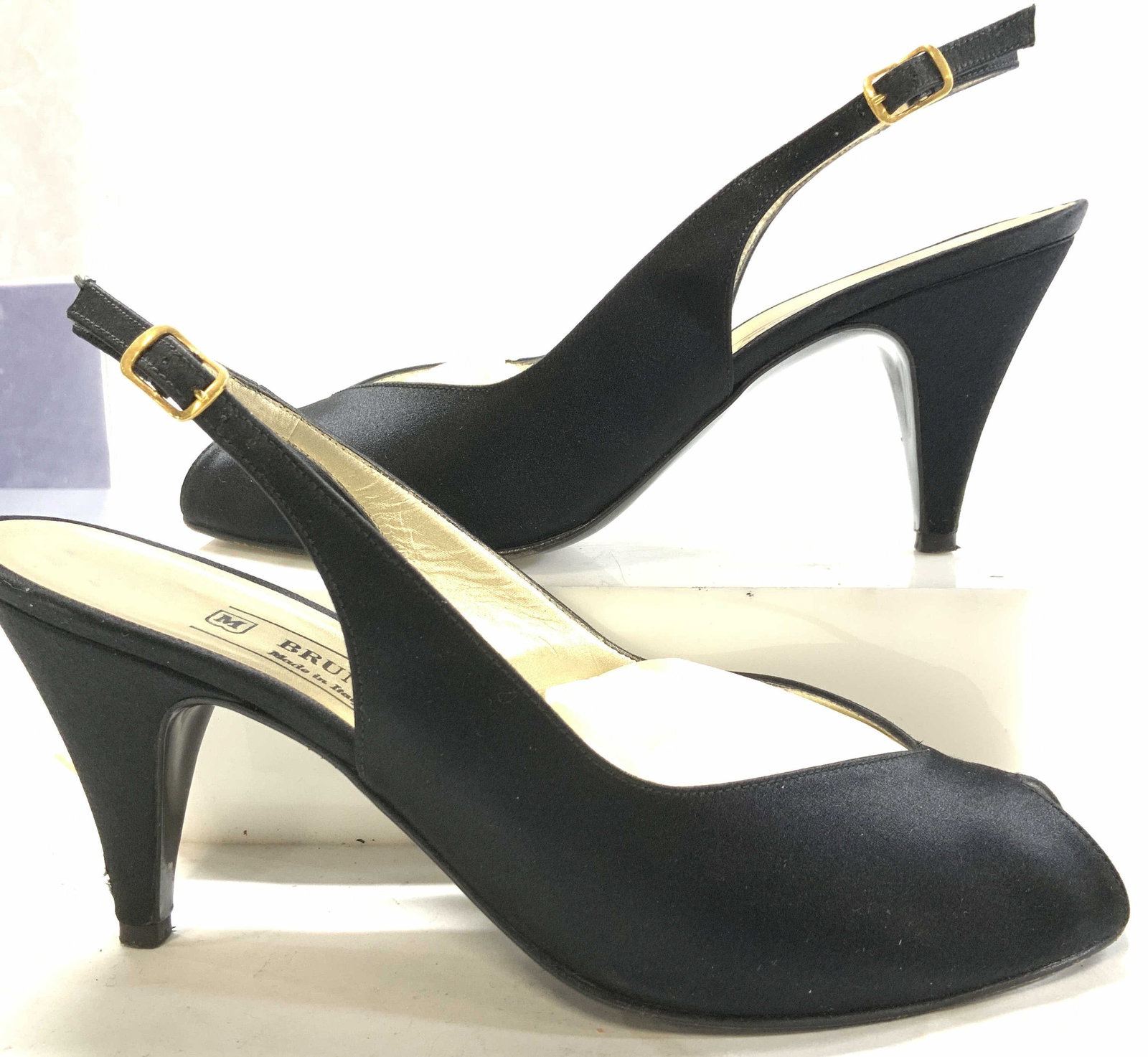 Bruno Magli Black Satin Pumps, Italy: 3.5 in. heel sling back high heels, Bruno Magli black silk open toe, adjustable ankle strap, size 8 Med. Made in Bologna, Italy. Wear consistent with use, age and exposure. Overall satin in very good 