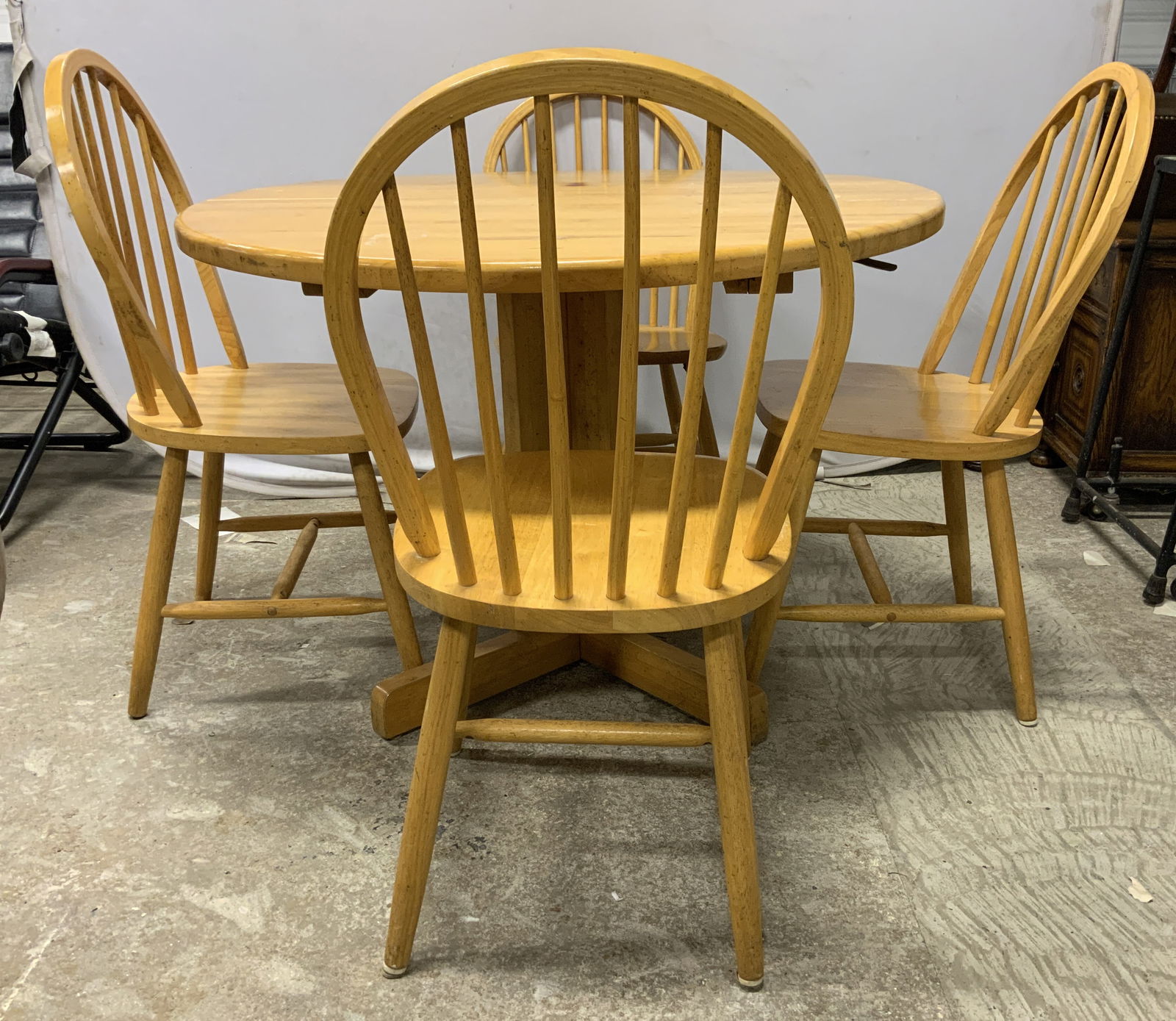 Set 5 Vntg Wooden Dining Table & Chairs: Lot includes 4 dining chairs & 1 dining table. Each Piece is tan toned and wooden. Chairs have spindle backrests. Table has pedestaled base. Chairs each have H shaped stretchers in between legs. Table