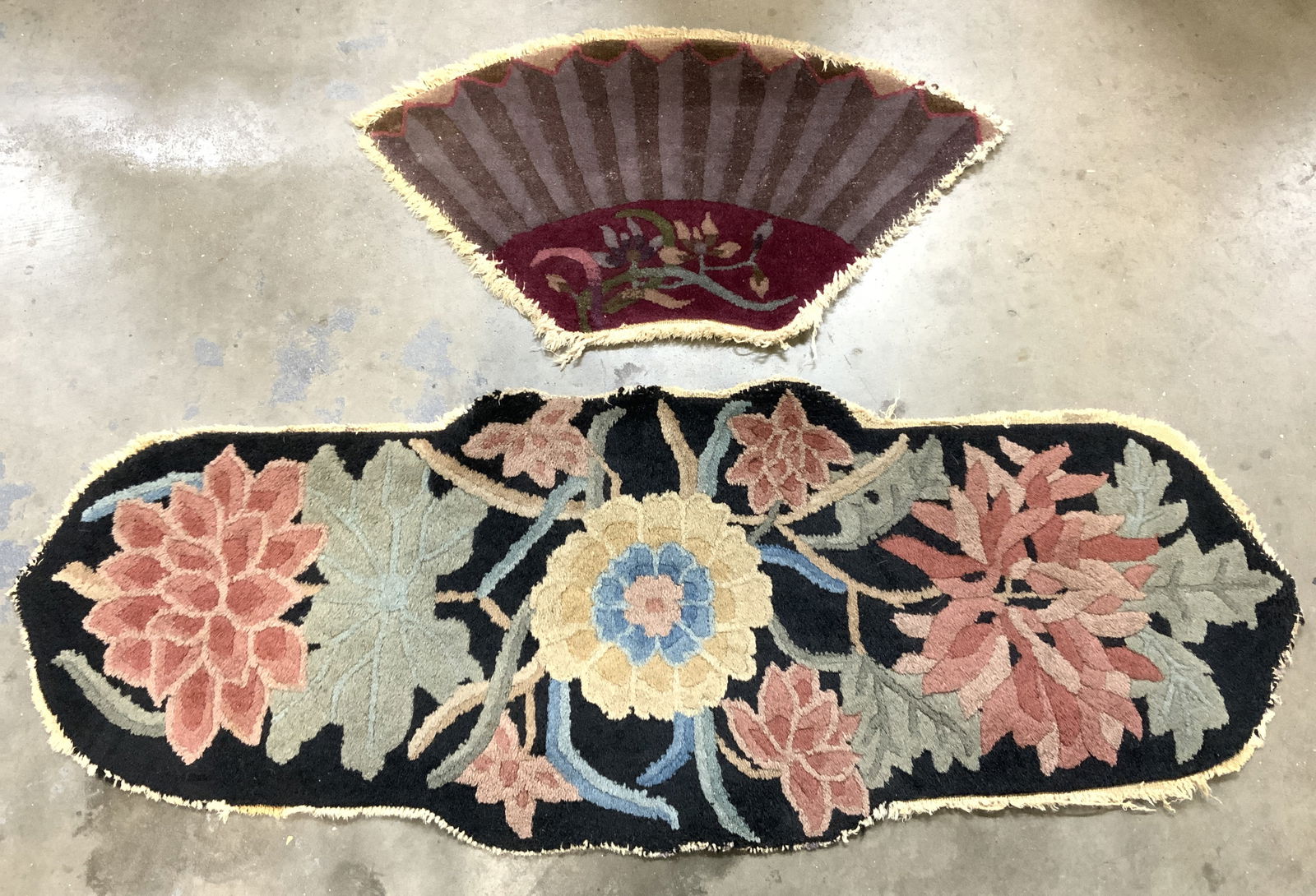 Lot 2 Vintage Handmade Chinese Art Deco Rugs: Lot includes 2 rugs. Each are handmade and vintage. One has hand fan shape while the other has multi toned floral & leaf detail. Largest rug measures approx 41 inches long 15 inches wide. Handmade rug