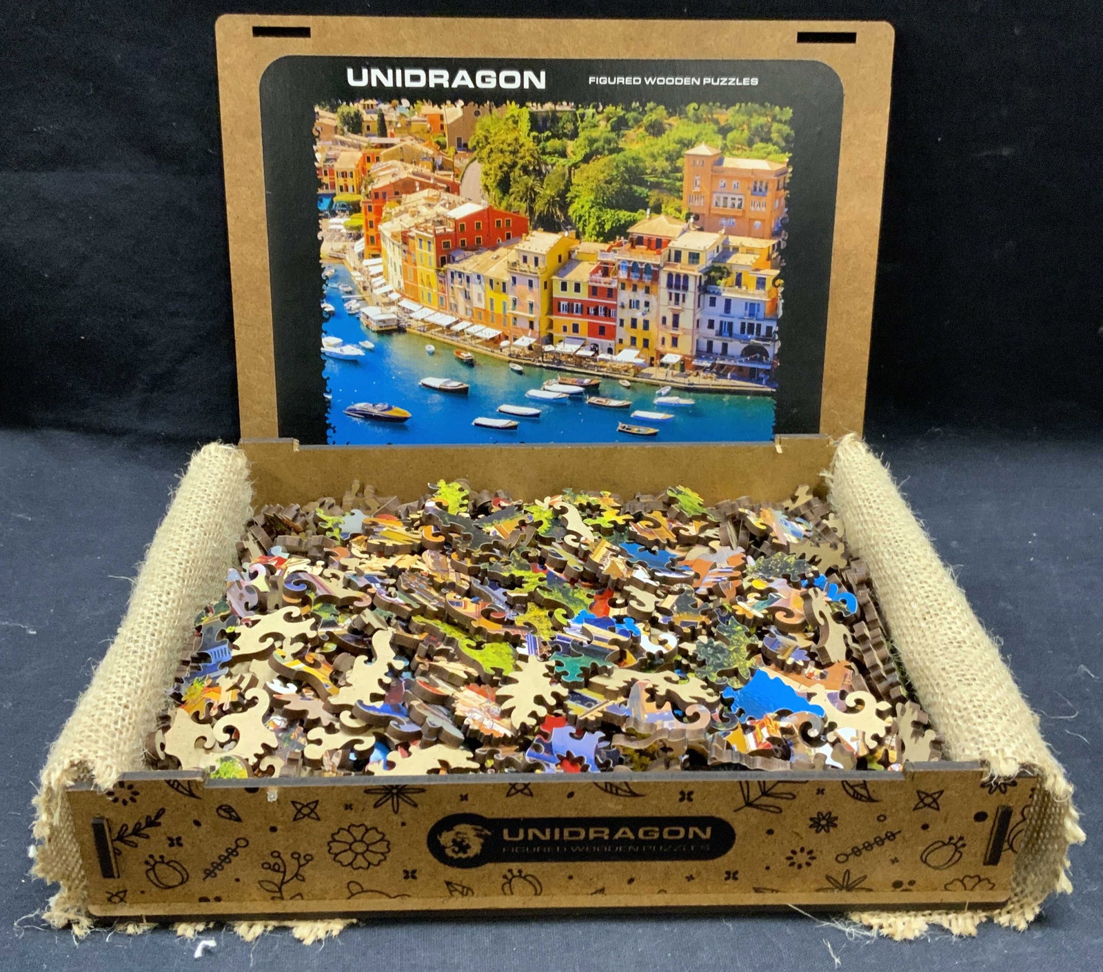 Unidragon Cityscape Wood Puzzle: Unidragon figured wood puzzle with original box. 500 piece puzzle with cityscape motif. Not inspected for total number of pieces. Box measures approx. 9 x 6.5 x 1.75 inches. Unidragon, Unidragon puzzl