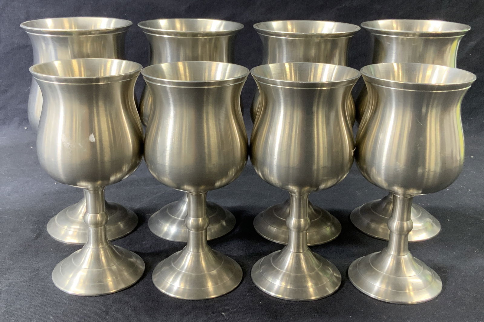 Set 8 Hallmarked Pewter Goblets, England: English pewter stemware goblets, a few hallmarks on verso. Made in LONDON, England. Set of 8, 4 of each size. Larger goblet measures 6 x 3.5 in. English Pewter Goblets, Signed LONDON England Pewter St