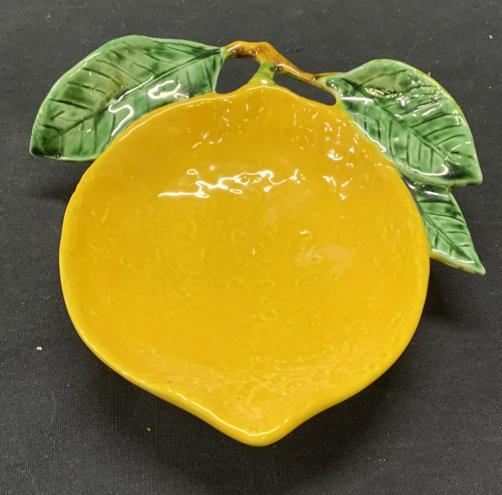 Freeman SECLA Ceramic Lemon Bowl, Portugal: Freeman SECLA ceramic lemon form bowl. Trademarked to underside. Made in Portugal. Some surface wear consistent with exposure. Measures approx. 7 x 7 7/8 x 2 inches. Freeman, freeman SECLA, freeman bo
