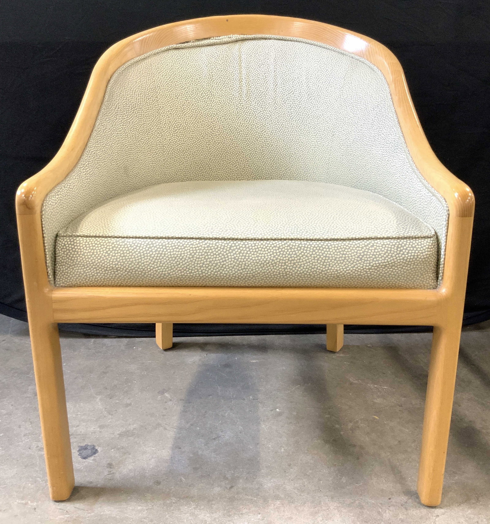 Mid Century Lounge Arm Chair: Single mid century lounge chair with light toned wooden frame and green textures upholstery. Approximately 32 inches tall x 25 inches wide, seat is approximately 18 inches tall 21 inches wide and 19 i