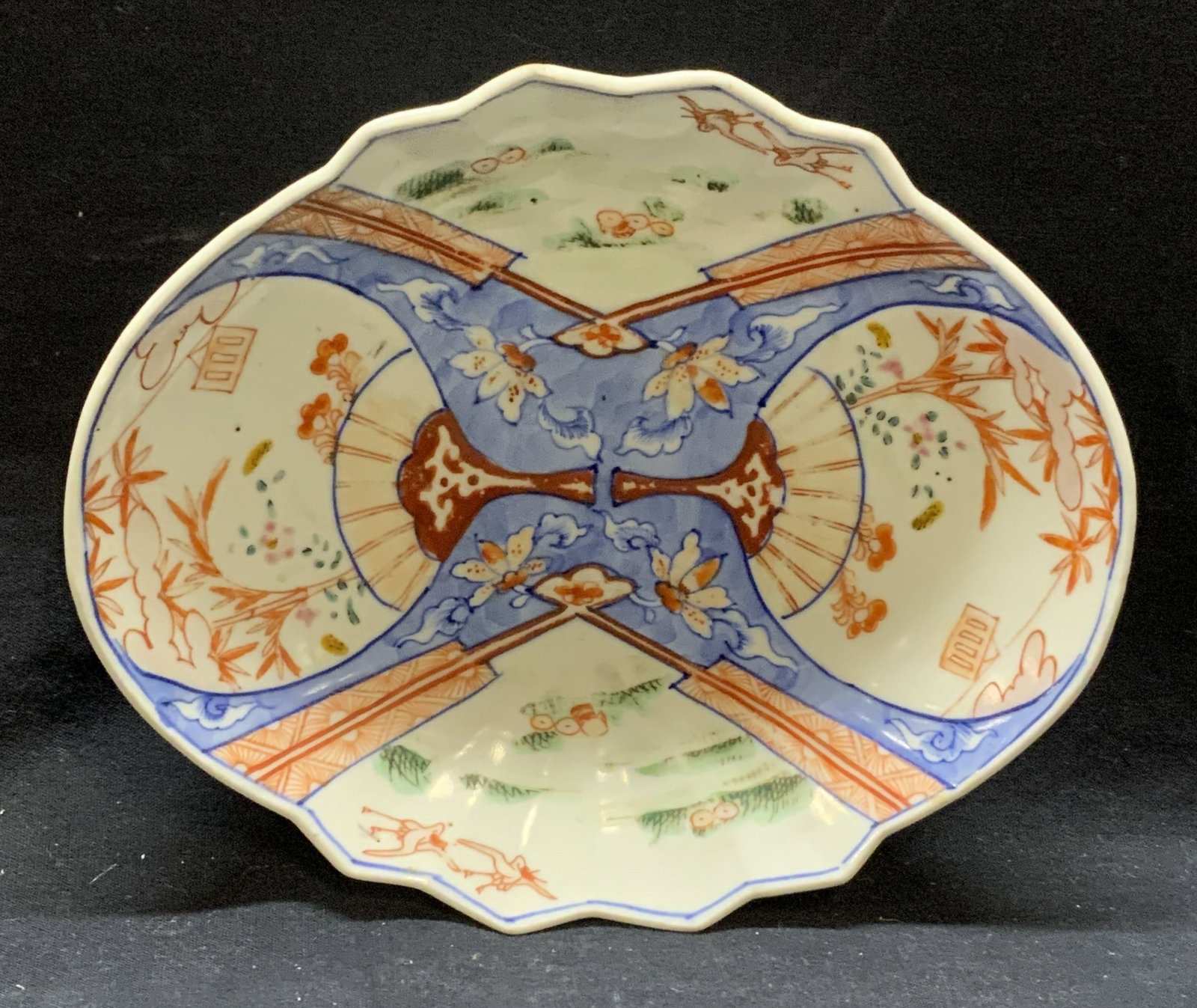 Antique Asian Porcelain Fan Dish: Antique Asian porcelain dish with hand painted fan and landscape motif. Some surface wear consistent with exposure. Measures approx. 7 3/8 x 6 3/8 inches. Circular potters mark to underside. Antiques,