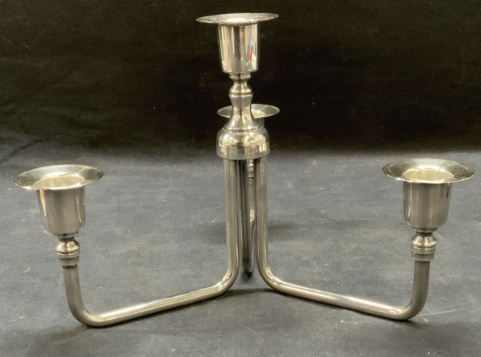 3 Arm Chrome Candlestick: 3 arm chrome candlestick. Some surface wear consistent with exposure. Measures approx. 9 x 6.5 inches. Candlestick, 3 arm candlestick, chrome candlestick, table decor, table accessories, home decor, h