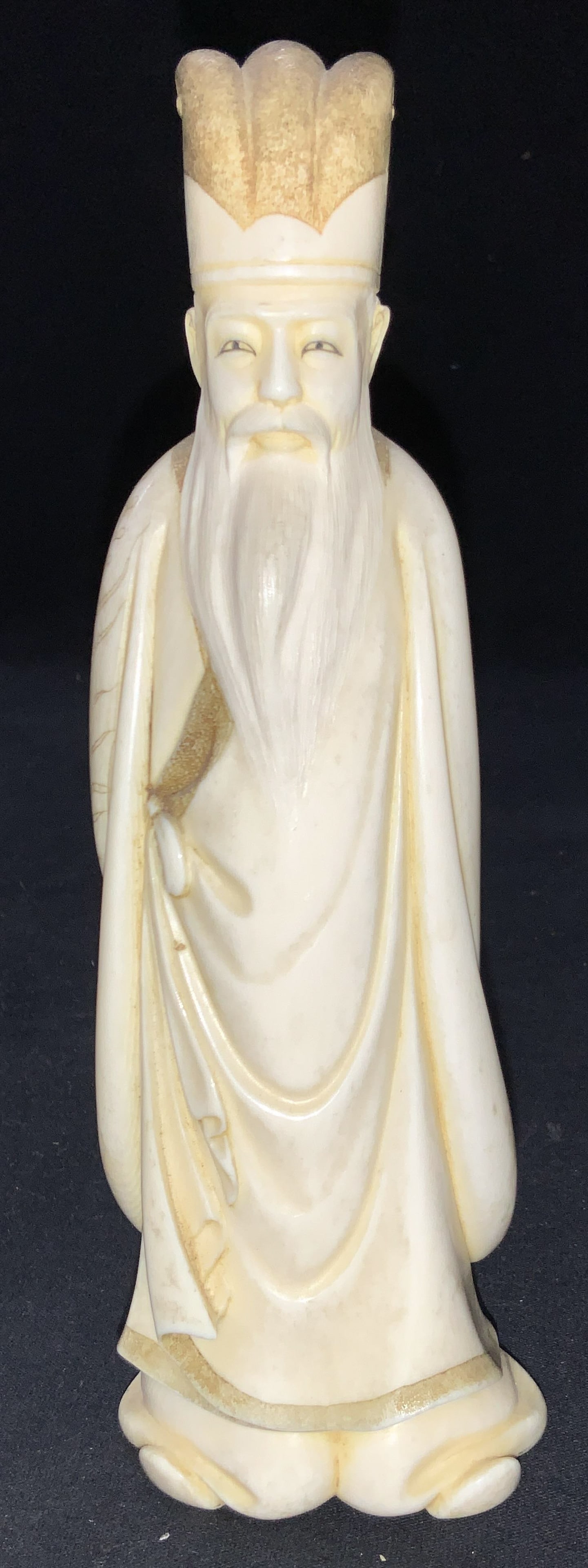 Vintage Stamped Carved Bone Asian Figural: Vintage stamped figure made of carved bone depicting an Asian man with a long beard and long robes with his hands behind his back. Marked on underside with Chinese characters. Approximately 7.5 inches