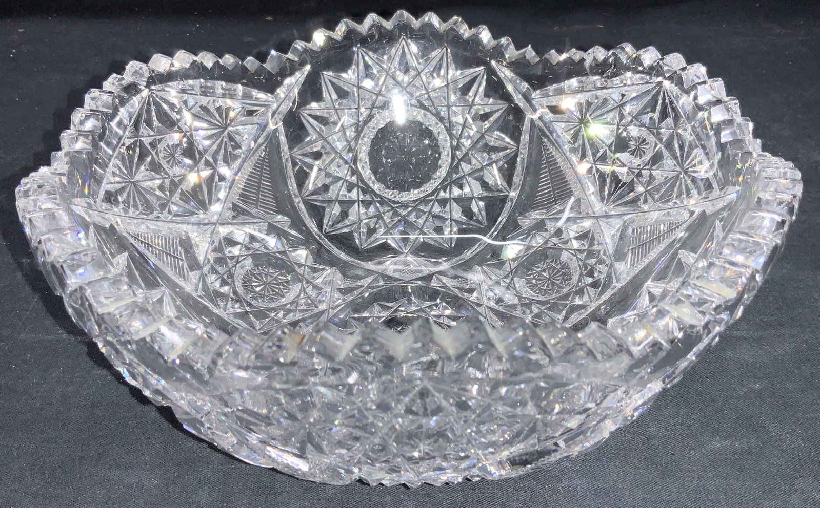 Vintage Thick Wall Cut Crystal Bowl: Vintage thick wall cut crystal bowl with saw tooth edges and Star burst exterior designs. Approximately 3.25 inches tall and 8 inch diameter. cut crystal bowl, bowl, vintage, crystal bowl crystal deco