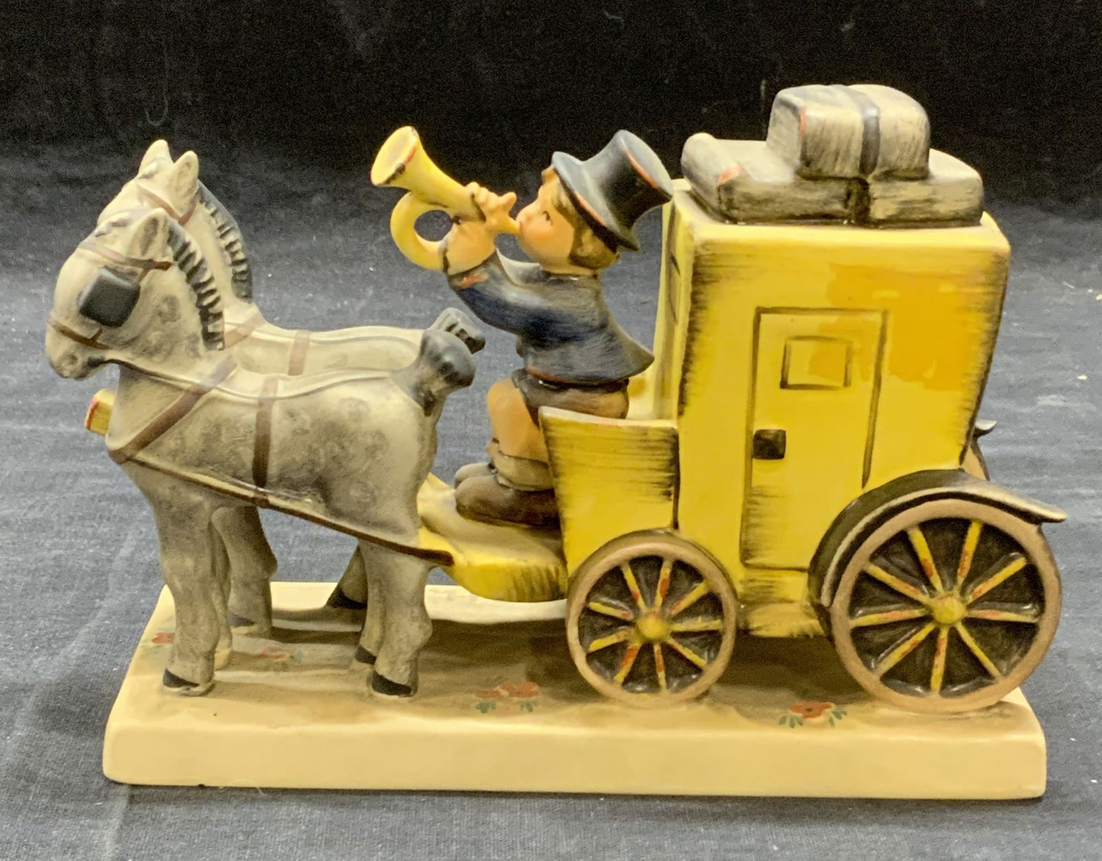 Vintage GOEBEL Porcelain Mail Is Here Figurine: Vintage Hummel GOEBEL porcelain The Mail Is Here mail wagon figurine. Trademarked to underside. Made in Germany. In good condition. Measures approx. 6.5 x 2.75 x 4.5 inches. GOEBEL, vintage GOEBEL, Hu