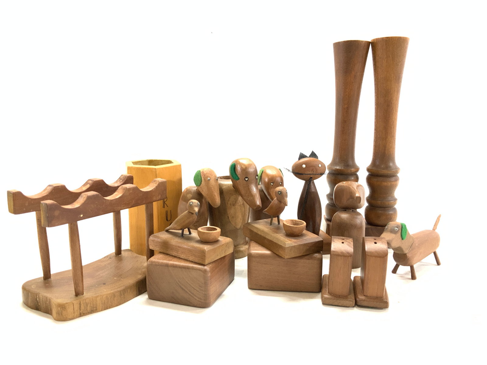 Lot of Carved Wood Folk Art Animals & Tableware: 16 items total. Carved Wood, all vintage , some mid century modern style. Animal figurals and table accessories. Pair Wood Candlesticks, 9.75 x 1.75 in. Some pieces might be teak. Pair salt and paper