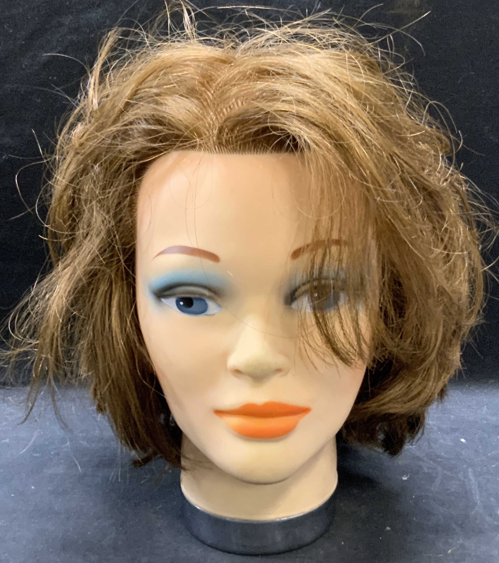 Rubber Cosmetology Mannequin Head: Rubber cosmetology mannequin head. Measures approx. 4.5 x 10 inches. Surface wear consistent with exposure. Mannequin head, cosmetology head, cosmetology training head, novelties, table accessories, t