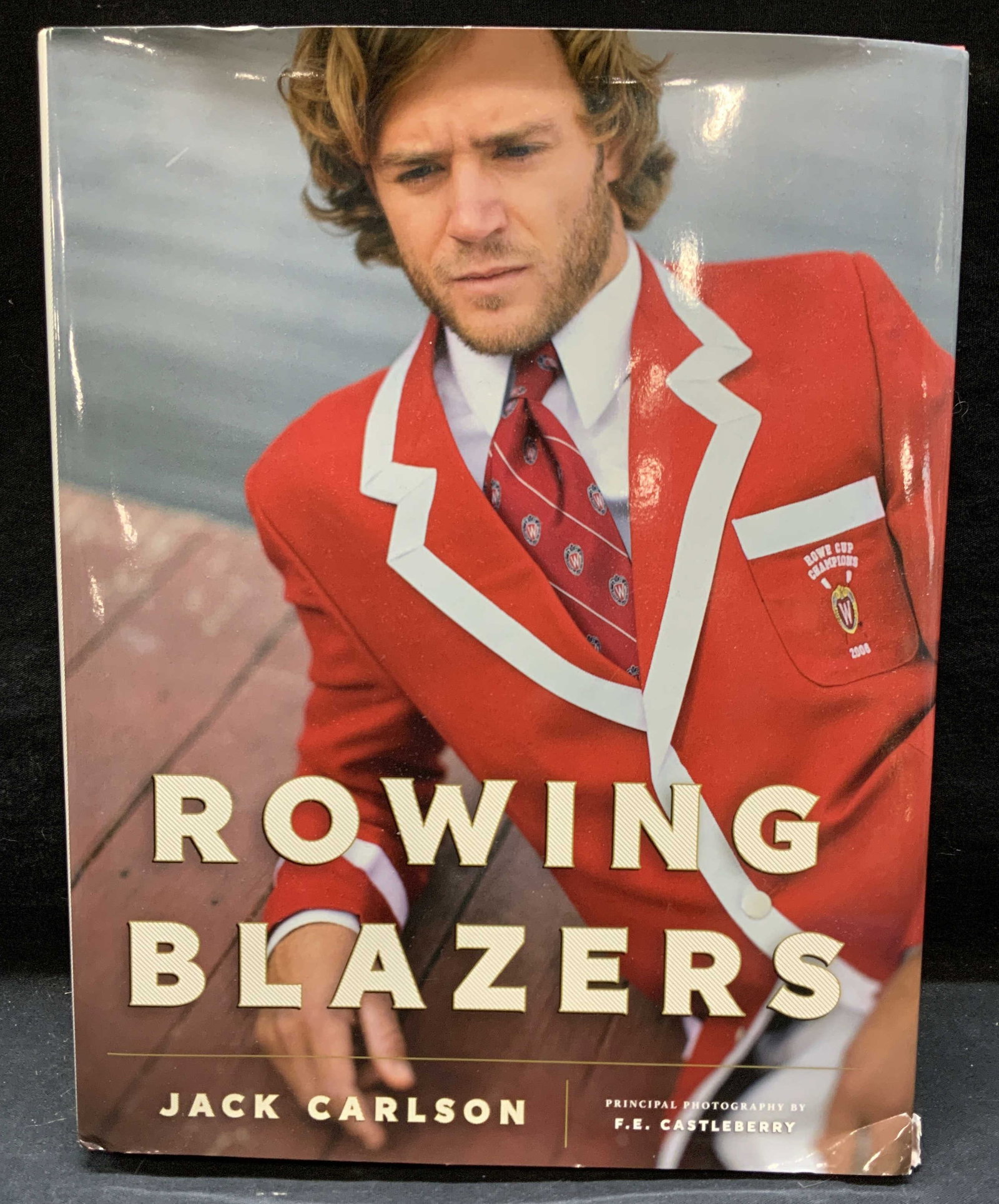 Rowing Blazers Jack Carlson Fashion Book: Hardcover copy of Rowing Blazers by Jack Carlson. Published by Vendome, 2014. Measures approx. 12.25 x 9.5 inches. Some general shelf wear observed. Rowing blazers, fashion book, photography book, cof