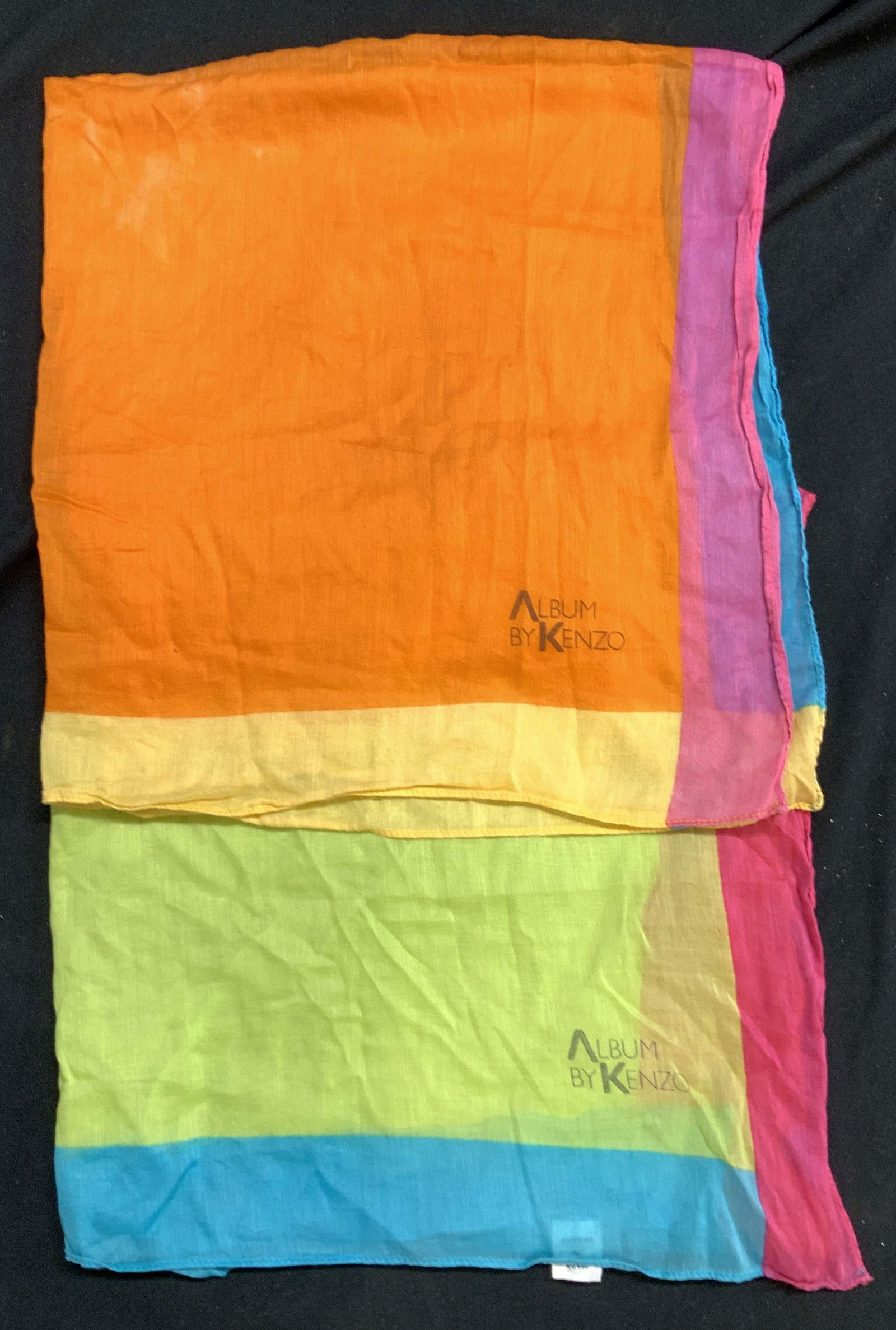 Pair KENZO Cotton Color Block Scarves, France: Album by KENZO neon color block cotton scarves, signed . Each measures 25 x 25.75 in. Labeled made in France . Light discoloration to the orange. Made in France accessories, KENZO cotton scarves, ladi