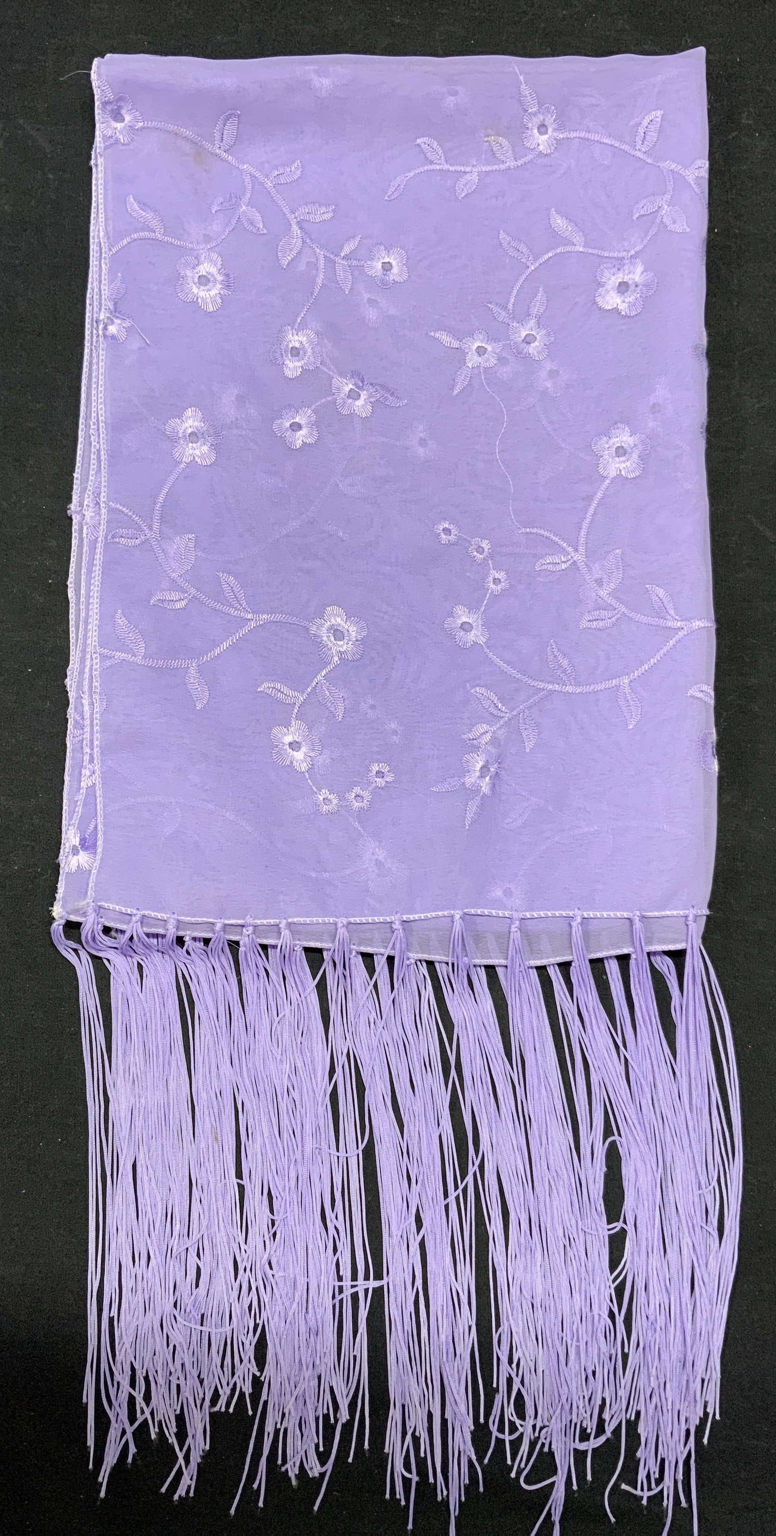 Purple Floral Fringe Scarf: Purple floral scarf with fringe trim. 100% polyester. Some wear consistent with exposure. Measures approx. 60 inches long. Purple scarf, floral scarf, fringe scarf, ladies accessories, ladies fashion