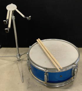 LUDWIG WeatherMaster Blue Drum, Drumsticks & More: A blue and silver toned drum, NOVA 5A wooden drumsticks, and a silver tone metal stand marked WSS. The stand has three moveable arms and is adjustable, two pieces. A metal piece is attached to the rev