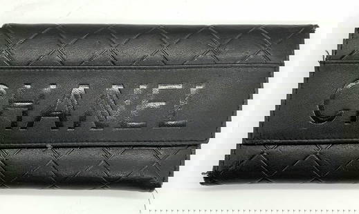 Chanel Style Black Leather Wallet: Chanel style black leather wallet. Piece has not been authenticated. Some wear consistent with exposure. Measures approx. 7 1/8 x 3 5/8 inches. Chanel style, chanel style wallet, ladies wallet, ladies