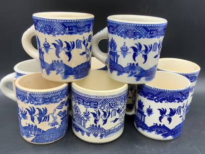 Lot 9 Blue & White Willow Ware Mugs, USA & More: Vintage blue & white ceramic mugs. Handles to one side on each mug. Some mugs are marked on underside USA or JAPAN. Some are not marked. Chinoiserie designs feature buildings, birds, foliage, and geom