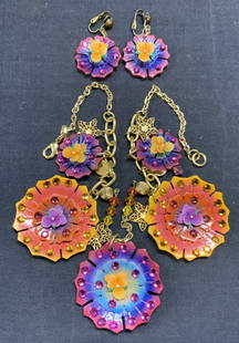 Pair TARINA TARANTINO Floral Necklace & Earrings: TARINA Tarantino matching necklace and earrings set. Orange and purple toned floral pendants with Swarovski crystal decoration. Earrings have clip on backings. All jewelry pieces have designed label t