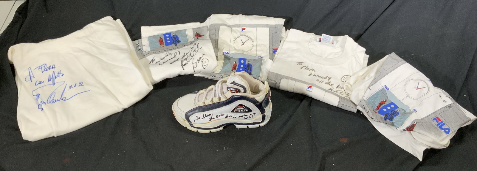 Lot 6 FILA T Autographed Shirts & Sneaker: Lot includes 5 T-shirts & 1 sneaker. Each are trademarked FILA. Shirt sizes includes 4/M, 5/L, 6 XL, 6 XL, & 40. Each piece is autographed illegibly. S shirts appear to be vintage. Fila, fila clothing