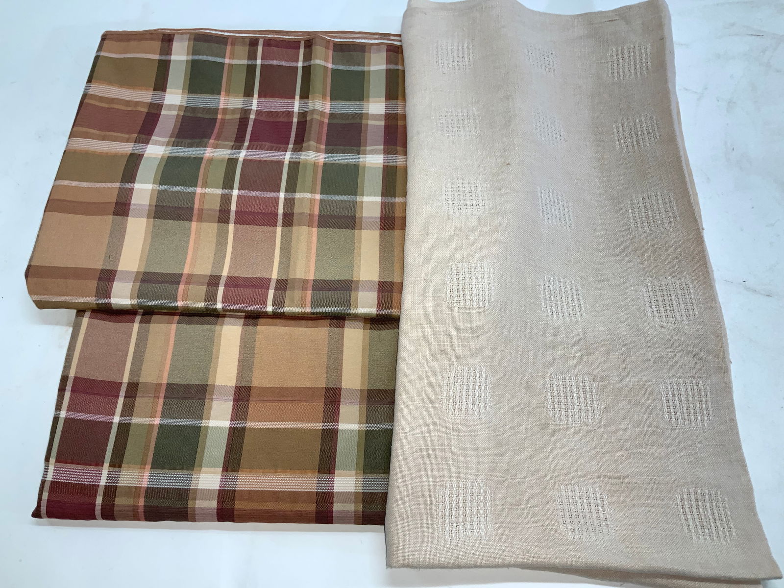 2 WC Designs Plaid Tablecloths, Linen Tablecloth: 2 W-C Designs muted green, wine , tan, and brown plaid tablecloths. 55% rayon, 45% polyester. A good fit for the fall season. Both 49.5 x 51 in. Thick beige linen tablecloth , 45 x 47 in. Tablecloth ,