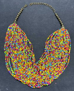Vintage Multi Strand Chunky Seed Bead Necklace: Vintage multi strand multi color chunky seed beaded necklace. Some surface wear consistent with exposure. Measures approx. 20 inches long, 5 inches wide. Estate jewelry, costume jewelry, cocktail jewe