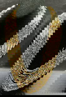 Multi Strand Seed Bead Necklace, Jewelry: Multi strand multi color seed beaded necklace. Measures approx. 25 inches long. Some surface wear consistent with exposure. Estate jewelry, costume jewelry, cocktail jewelry, fashion jewelry, accessor