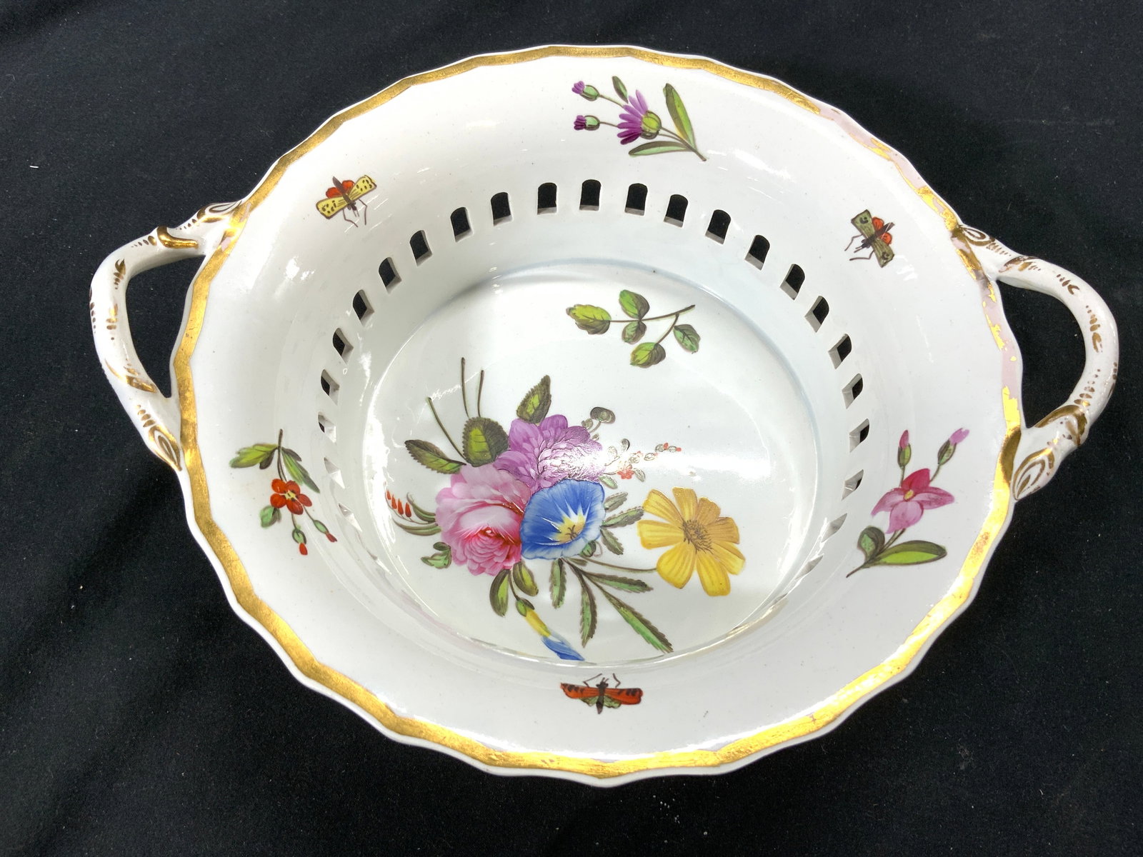 SPODE Vintage Pierced Porcelain Basket W Handles: Underside is inscribed SPODE. Piece is vintage. Basket is white toned & porcelain with gilt rim & handles. Piece has floral & leaf detail which appear to be hand painted. Measures approximately 9.25 i