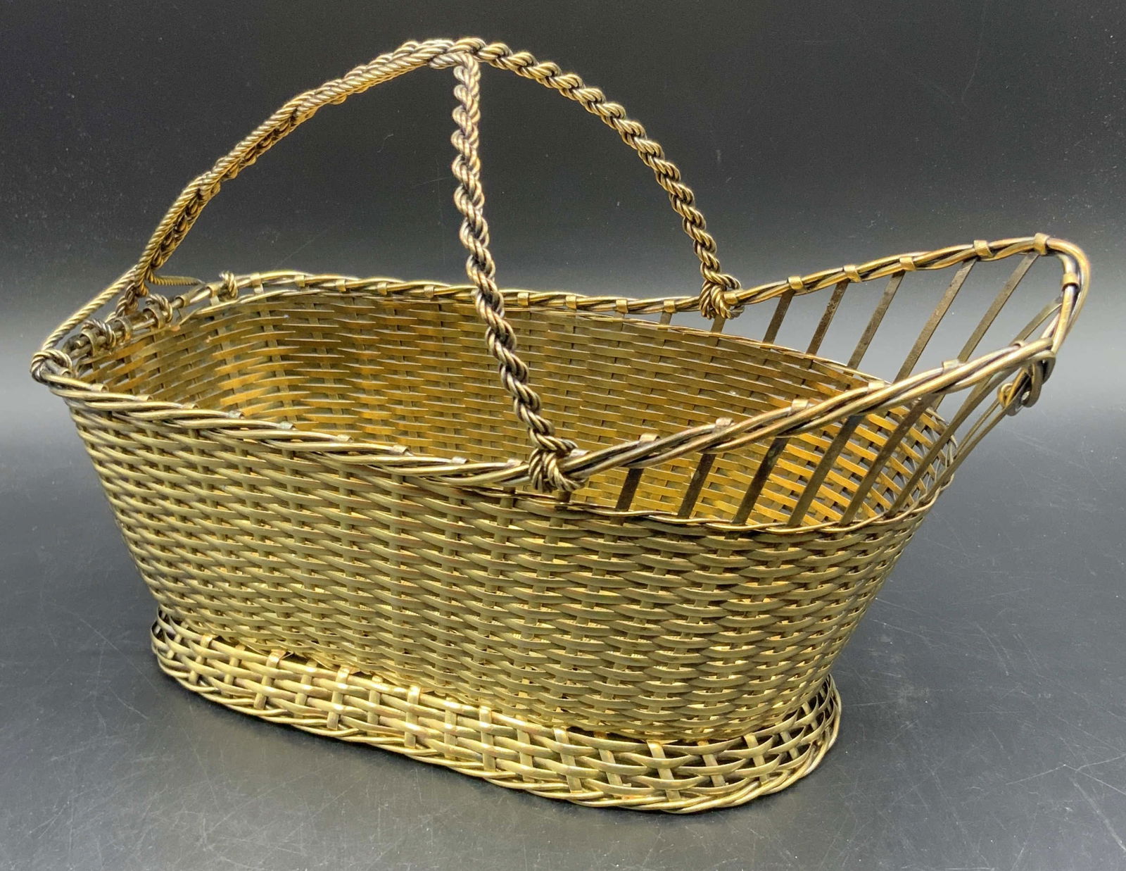 CHRISTOFLE O.C. Collect Gallia Wine Basket France: A vintage Christofle O.C. Collection Gallia vermeil silver plated woven wine basket. Stamped on underside Christofle France, O C, Coll GALLIA. O.C. Measures approx. 6.25H x 9.25W in. Height includes h