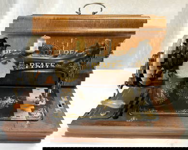 GM PFAFF Antique Sewing Machine: Machine reads GM PFAFF KAISERSLAUTERN. Piece is antique serial no 1089747. PIece is black and gold toned & metal with wooden base. Piece includes key. Machine includes painted cover which reads PFAFF