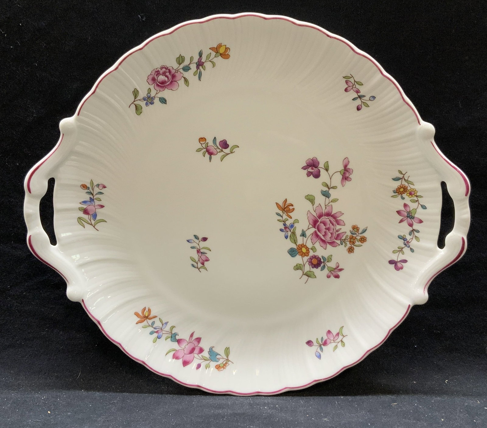 BERNARDAUD Limoges Porcelain Platter, France: BERNARDAUD Limoges porcelain platter/tray with floral motif. Trademarked to underside. Made in France. Some surface wear consistent with exposure. Measures approx. 10.5 inches diameter. BERNARDAUD, BE