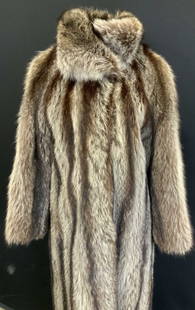 DAVELLIN NY Raccoon Fur Coat: Full length raccoon fur coat, signed label DAVELLIN NY . 49 in. L Hook and loop under neck, at chest, waist, and hips. Snap closed to keep from loosening. Reinforced under shoulder pads sewn to arm sl