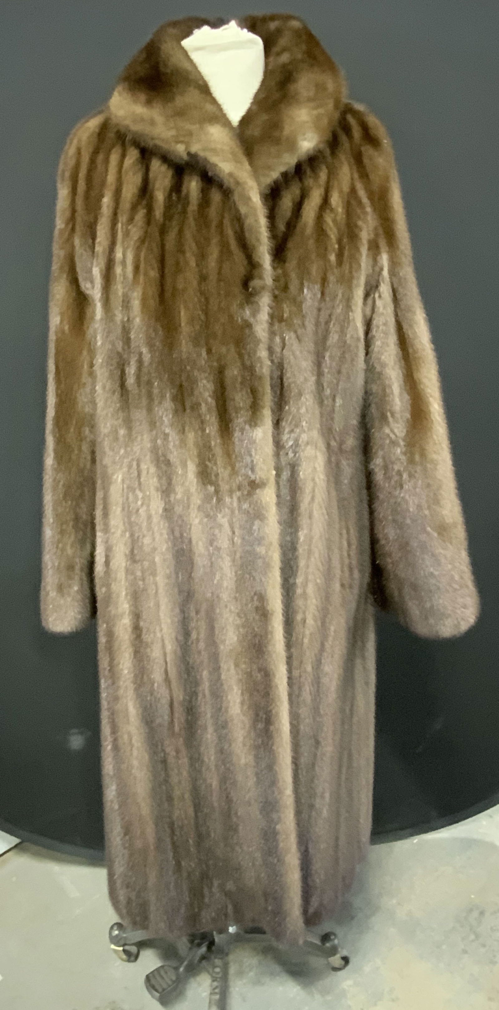 Vintage Davellin Brown Mink Fur Coat: Vintage Davellin brown mink fur coat. Designer label to interior. Some wear to material consistent with exposure. Measures approx. 20 inches across chest, 46 inches from shoulder to hem. Property from