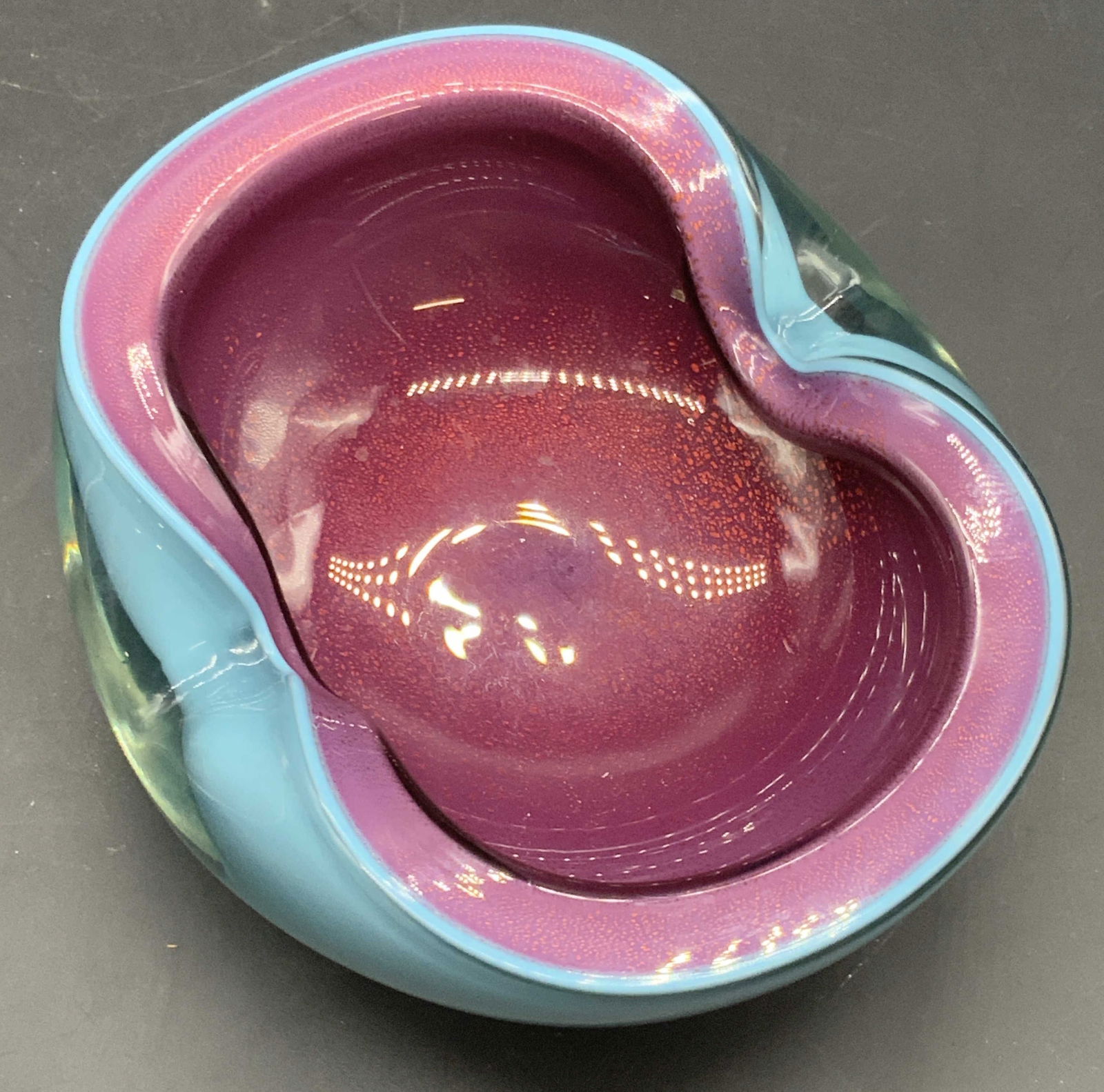 Murano Turquoise & Raspberry Blown Art Glass Bowl: A Murano blown Art glass bowl. Sommerso style turquoise and raspberry hues. Gold flecked interior. Thick walled and weighty. Possibly Alfredo Barbini design. Measures approx. 2H x 5.75W in. Measured a