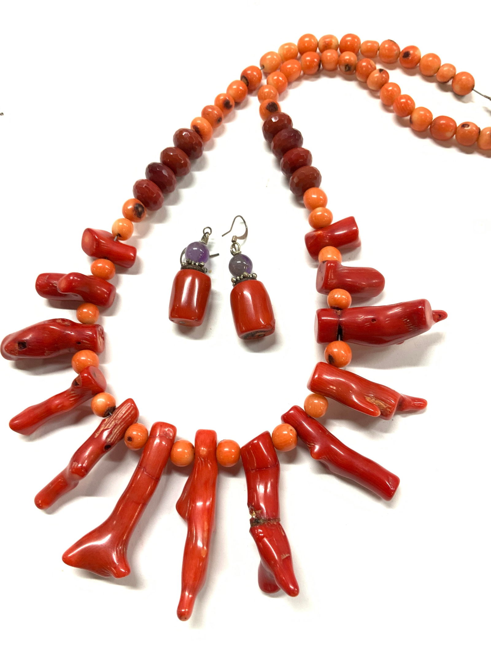 Red Coral Branch Bib Necklace, Earrings, 3: Luxury hand crafted round orange coral bead necklace with red coral branches., and coral with amethyst bead fish hook earrings. Faceted red glass beads. 671 ctw Comes in red velvet pouch. Earrings dan