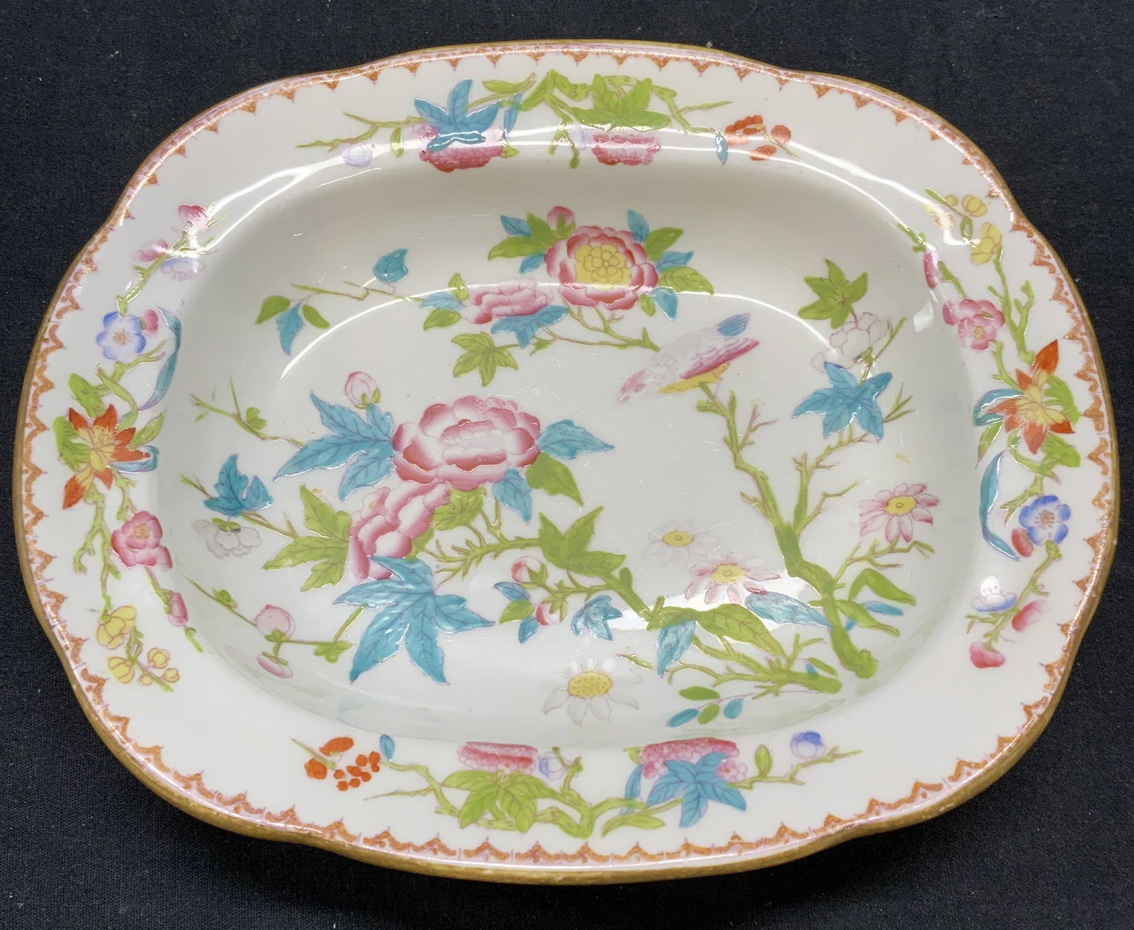 Antique MINTONS Gilman Collamore Porcelain Bowl: Antique MINTONS Gilman Collamore porcelain bowl with chinoiserie floral pattern. Trademarked to underside. Measures approx. 9 x 7.5 x 1.75 inches. Some surface wear including scratching observed. Made