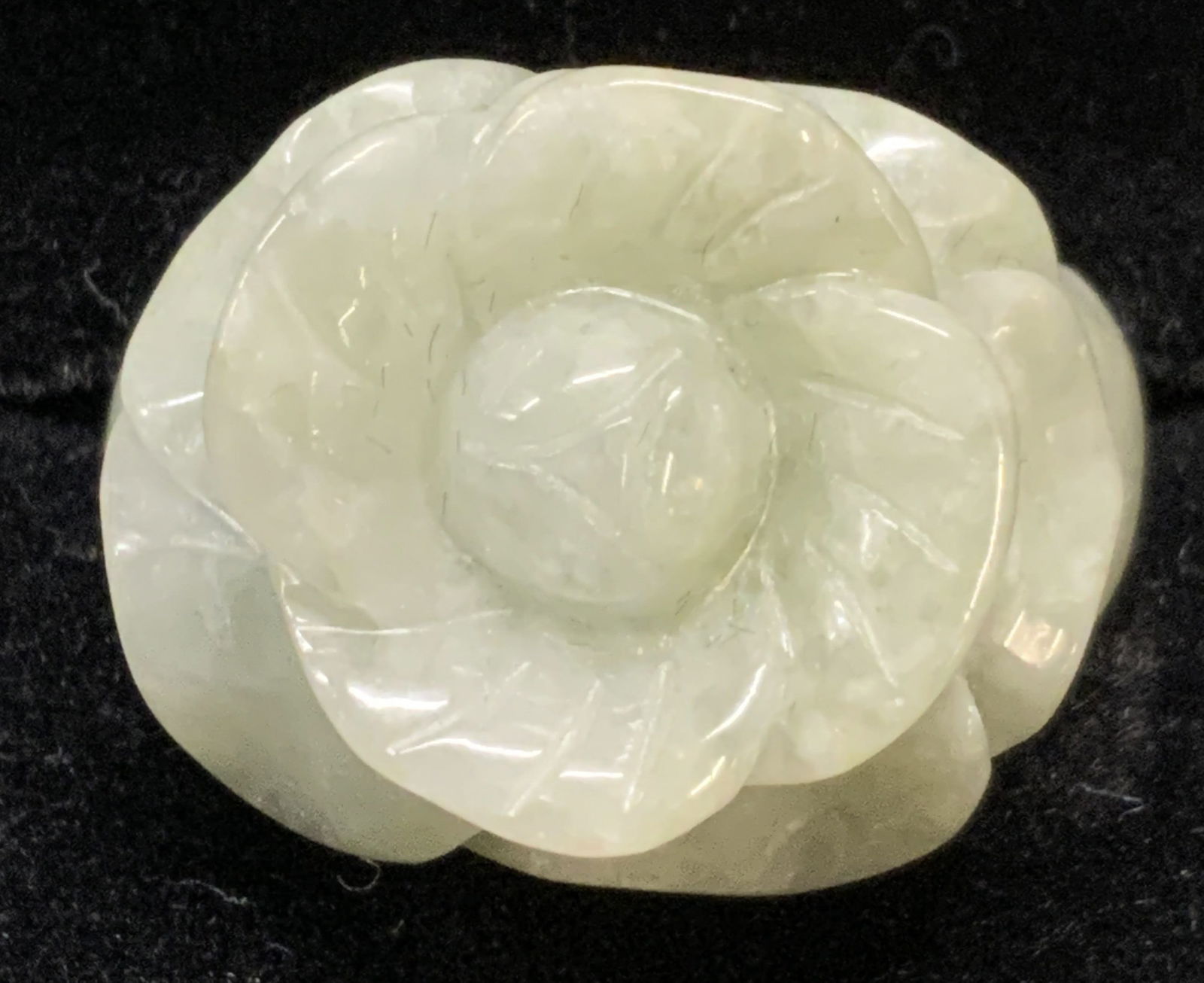 Signed Carved Jadeite Flower Ring, Jewelry: Carved jadeite ring with flower motif. Ring size 8.75. Measures approx. .75 inches wide. Signed to interior band. Marked 925, with hallmark, China. Some surface wear including small scratched observed