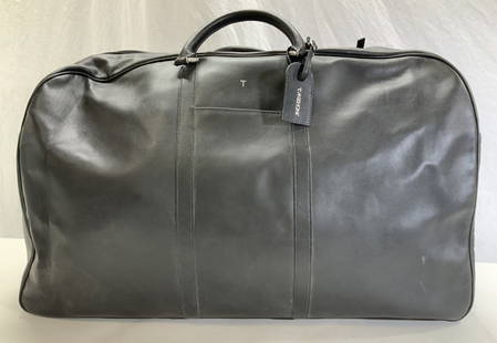 T. ANTHONY Oversized Leather Duffel, Italy: Luxury T Anthony black leather footed oversized duffel bag with luggage tag. Luggage Tag signed T. Anthony. Bag signed with name plate on interior. Measures 29 x 9.5 x 18 in. LxWxHt , like new , seldo