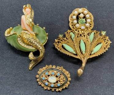 3 FLORENZA & HOBE Brooches, More: Lot of 3 jewelry pieces. FLORENZA gold tone beaded enamel brooch. Designer label to underside. Measures approx. 1 x .75 inches. Hobe gold tone faux pearl, crystal, and Cabochon flower brooch. Designer