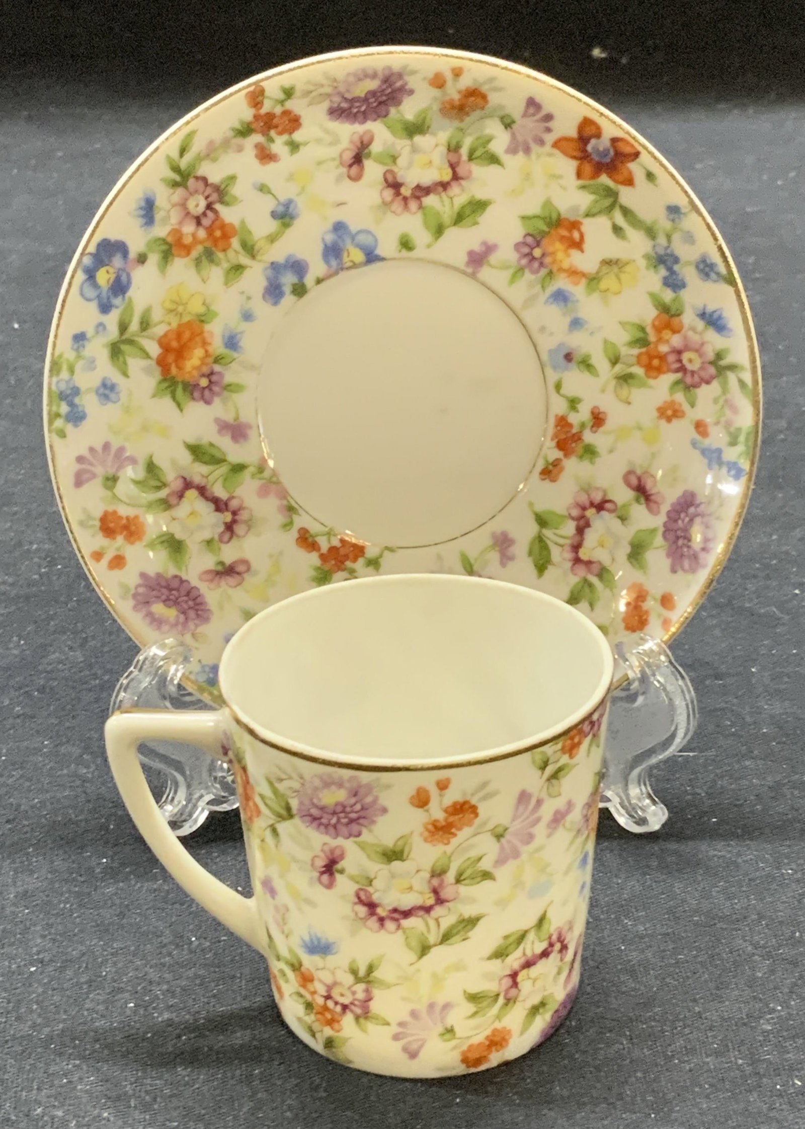 Vintage SGK China Floral Demitasse & Saucer: Vintage SGK China floral pattern demitasse cup and saucer. Made in Occupied Japan. Trademarked to undersides. Saucer measures approx. 4 inches diameter. Cup measures approx. 1 7/8 x 2 inches. Both pie