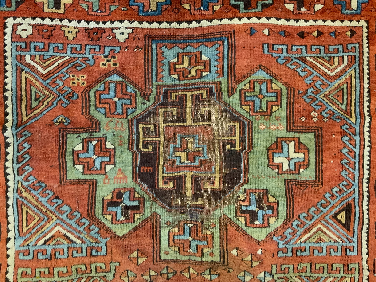 Vintage Handmade Fringed Turkish Wool Rug: Rug is handmade and wool. Piece has intricate multi toned geometric detail. Rug has sand toned fringes. Piece measures approx 57 inches long 41 inches wide. Rug, carpet, handmade rug, wool rug, Turkis