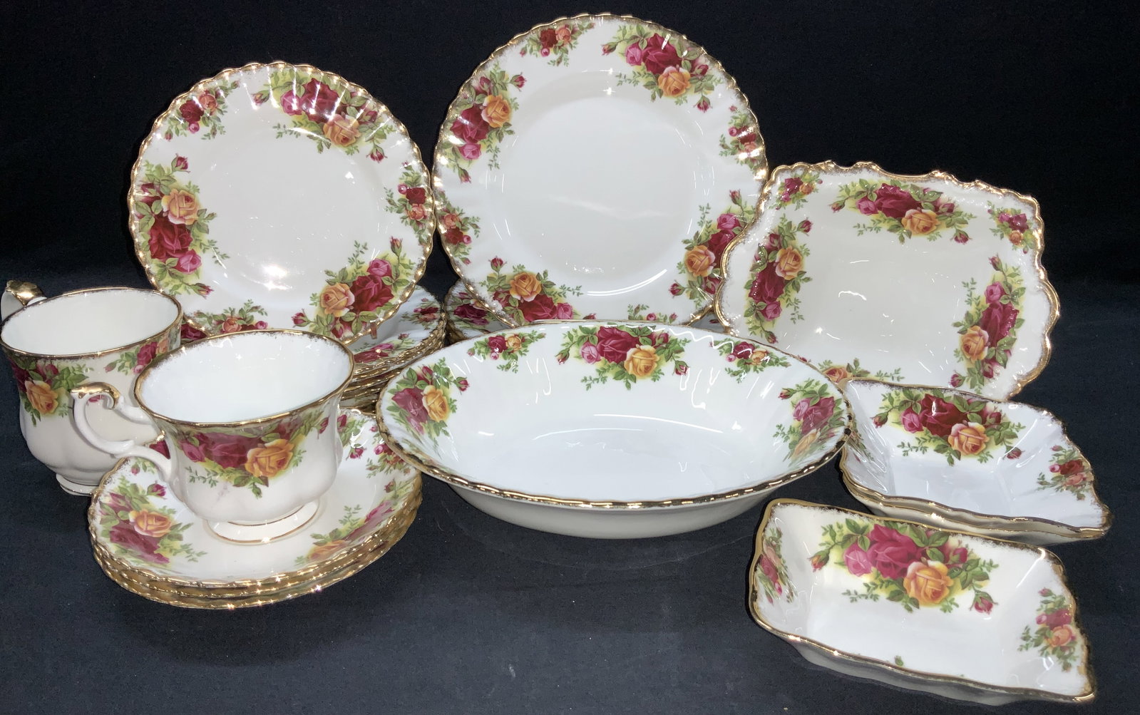 22 ROYAL ALBERT Bone China Set, Old Country Rose: Set of 22 Royal Albert fine china, made in England in the pattern of old a country Rose. Set includes 1 bowl at 9 inch diameter, 4 dishes at 8.5 inch diameter, 8 dishes at 6 inch diameter, 3 saucers a