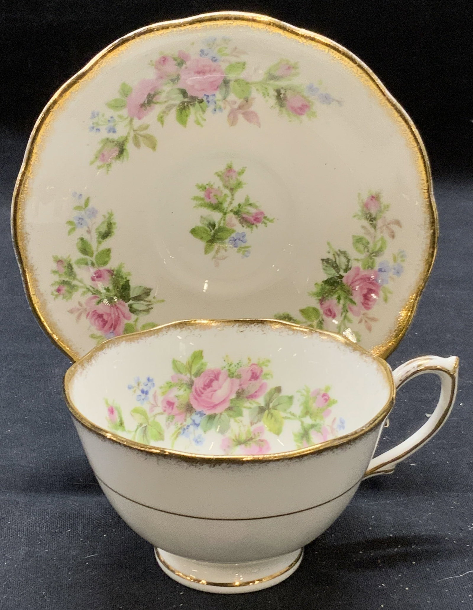 Roslyn China Moss Rose Teacup & Saucer England: Roslyn fine bone china Moss arose pattern teacup and saucer. Trademarked to undersides. Made in England. Some surface wear to each consistent with exposure. Saucer measures approx. 5.5 inches diameter