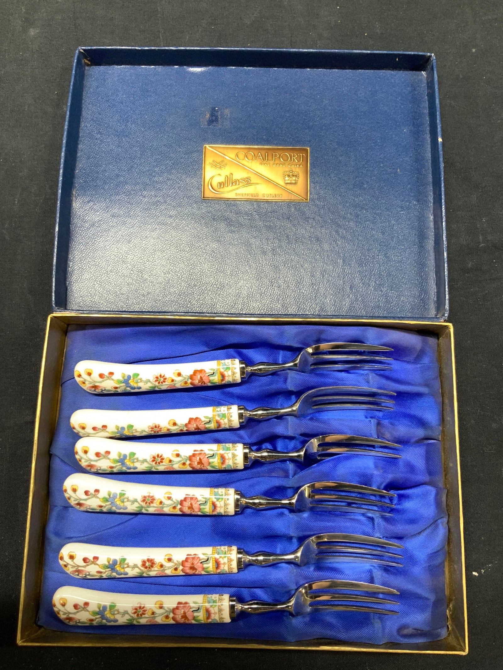 Set6 CoalPort Chinoiserie Porcelain Forks, org Box: Set of 6 fine bone China cocktail forks with images of various flowers in asian styles. Comes in original box, marked CoalPort, cultuss, fine bone China, Sheffield Cutlery. Box is navy blue with golf 