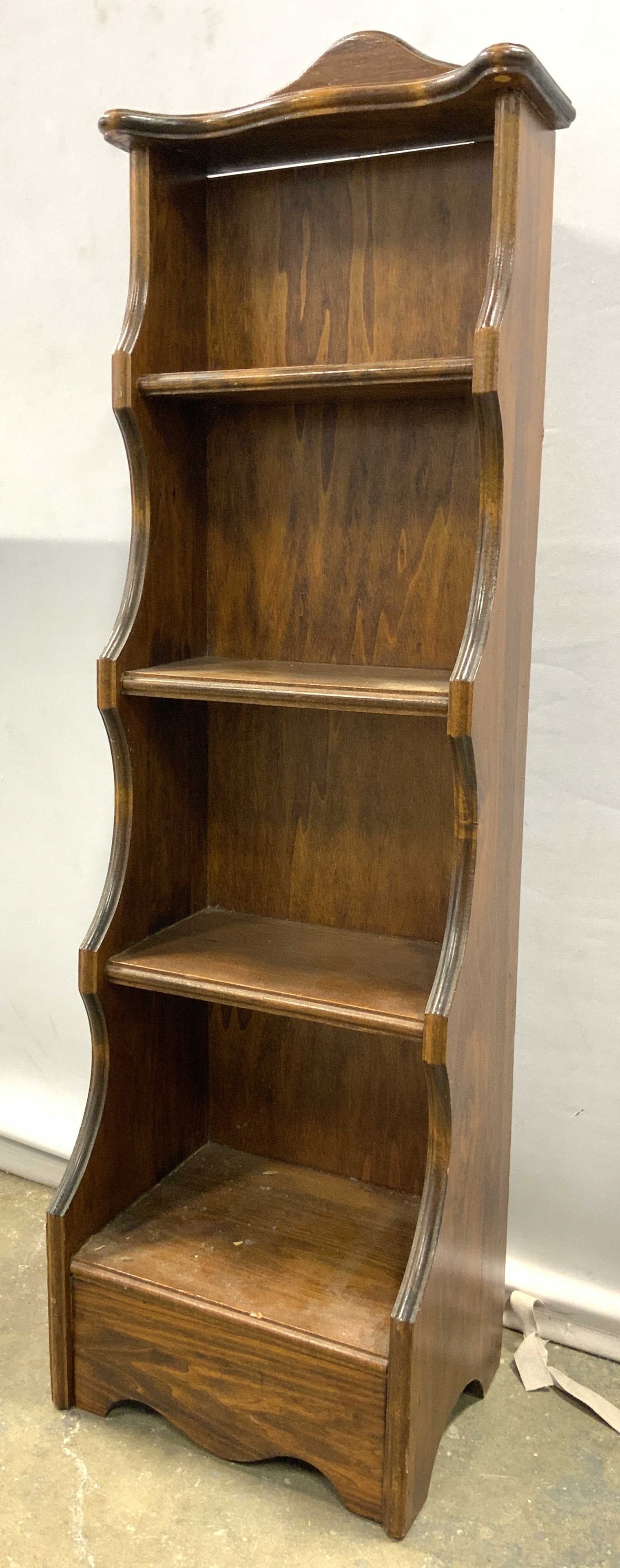 Vintage Carved Wooden Wall Shelf: Wall shelf is vintage and appears to be wooden possibly veneer. Piece has light brown tone. Structure has 3 shelves. Piece measures approx 47 inches tall 13 inches wide 10 inches deep. Wall shelf, woo