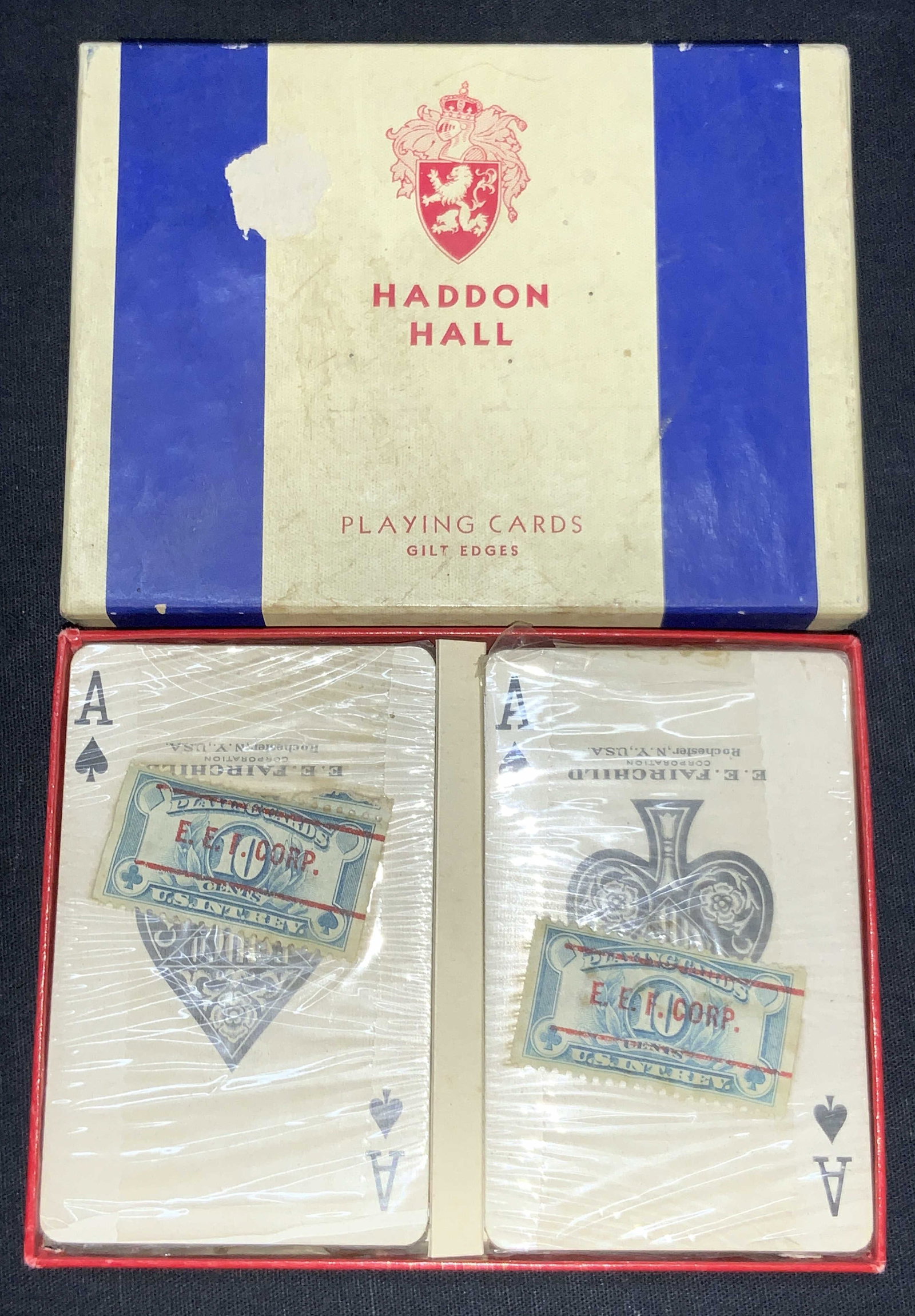 Haddon Hall Gilt Edge Vintage Playing Cards, NIP: Set of playing cards, still in plastic covers in box marked Haddon Hall, Playing cards,Gilt Edge with a red crest of a lion with a knights helmet above it. Cards has stands that read Playing Cards 10,