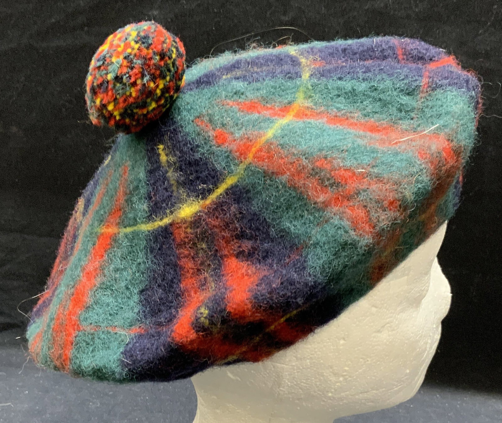 Monteiths Glasgow Wool Tartan Hat, Scotland: Vintsge Monteiths of Glasgow wool hat with tartan pattern. Designer label to interior. Some wear to material consistent with exposure. Made in Scotland. Measures approx. 5.5 inches wide, 10 inches tot