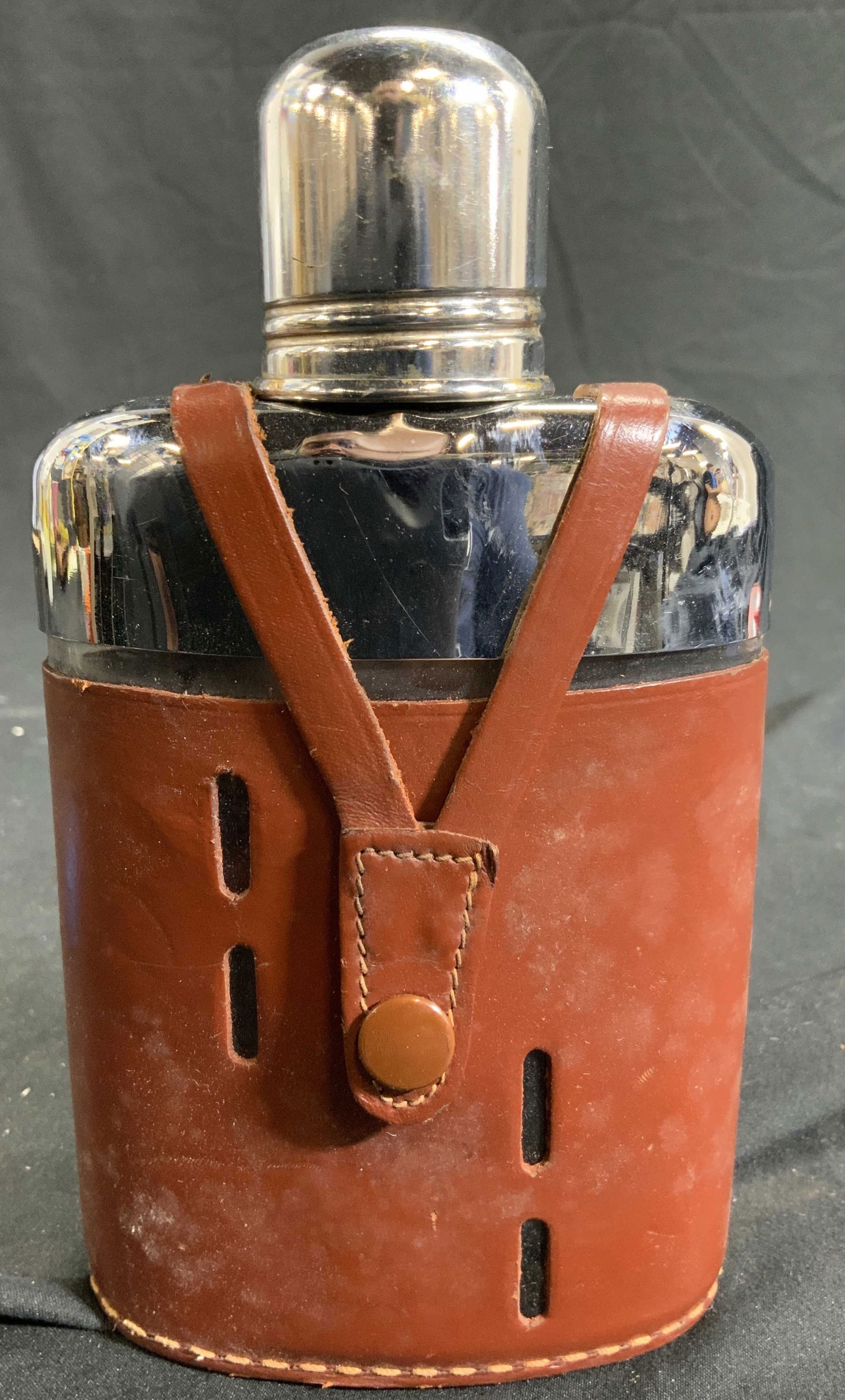 Metal & Hide Flask W Cap In Box ENGLAND: Underside reads REAL HIDE MADE IN ENGLAND. Flask is metal and brown toned Leather/Hide. Flask includes box. Piece measures approx 6.5inches tall 3.5 inches wide. Flask, metal flask, metal and hide fla