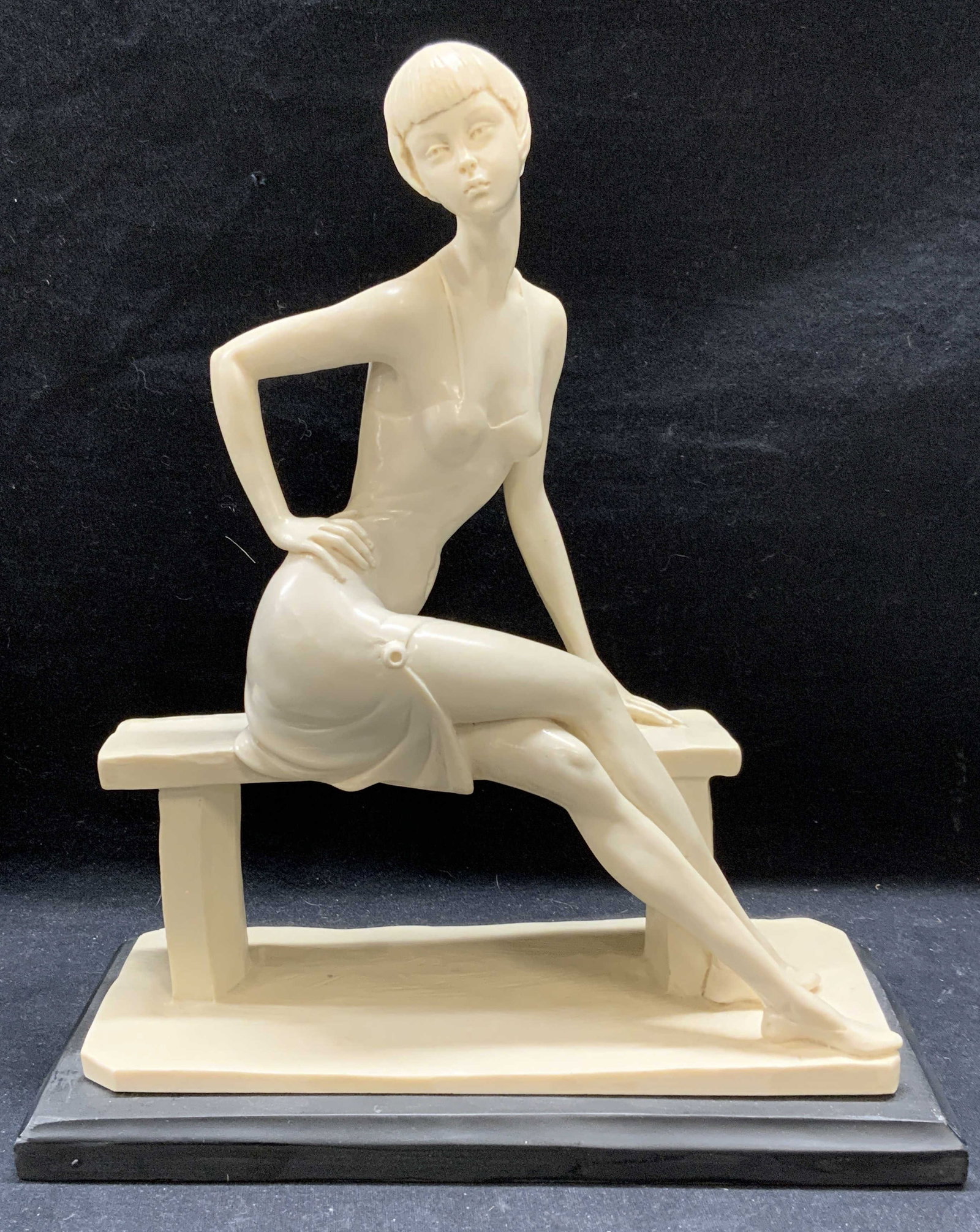A. Santini Signed Young Woman Seated Sculpture: Signed A. Santini sculpture of a young woman seated on a bench. Signed to reverse. Marble dust and resin. Some surface wear consistent with exposure. Measures approx. 10 x 4.75 x 11.5 inches. A Santin