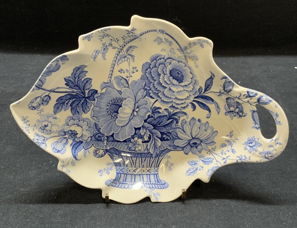 Charlotte Royal Crownford Leaf Plate, England: Charlotte Royal Crownford ironstone leaf plate with flower basket motif. Trademarked to underside. Made in England. Measures approx. 9 x 6.5 inches. Some surface wear consistent with exposure. Charlot