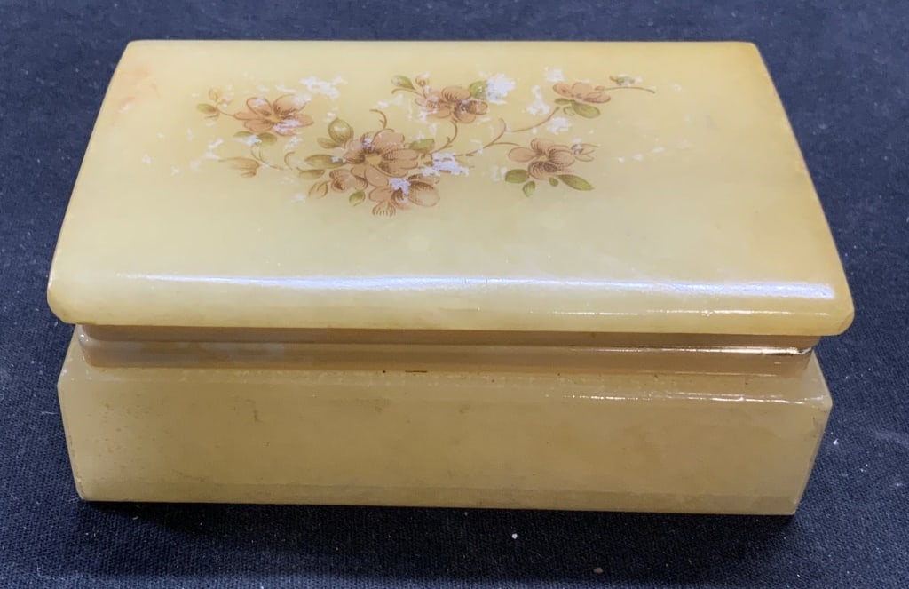 Carved Alabaster Jewelry Dresser Box, Italy: Carved alabaster jewelry/dresser box with floral motif. Frame needs repair. Marked made in Italy to underside. Surface wear consistent with exposure. Measures approx. 4 3/8 x 2.75 x 1.5 inches. Alabas