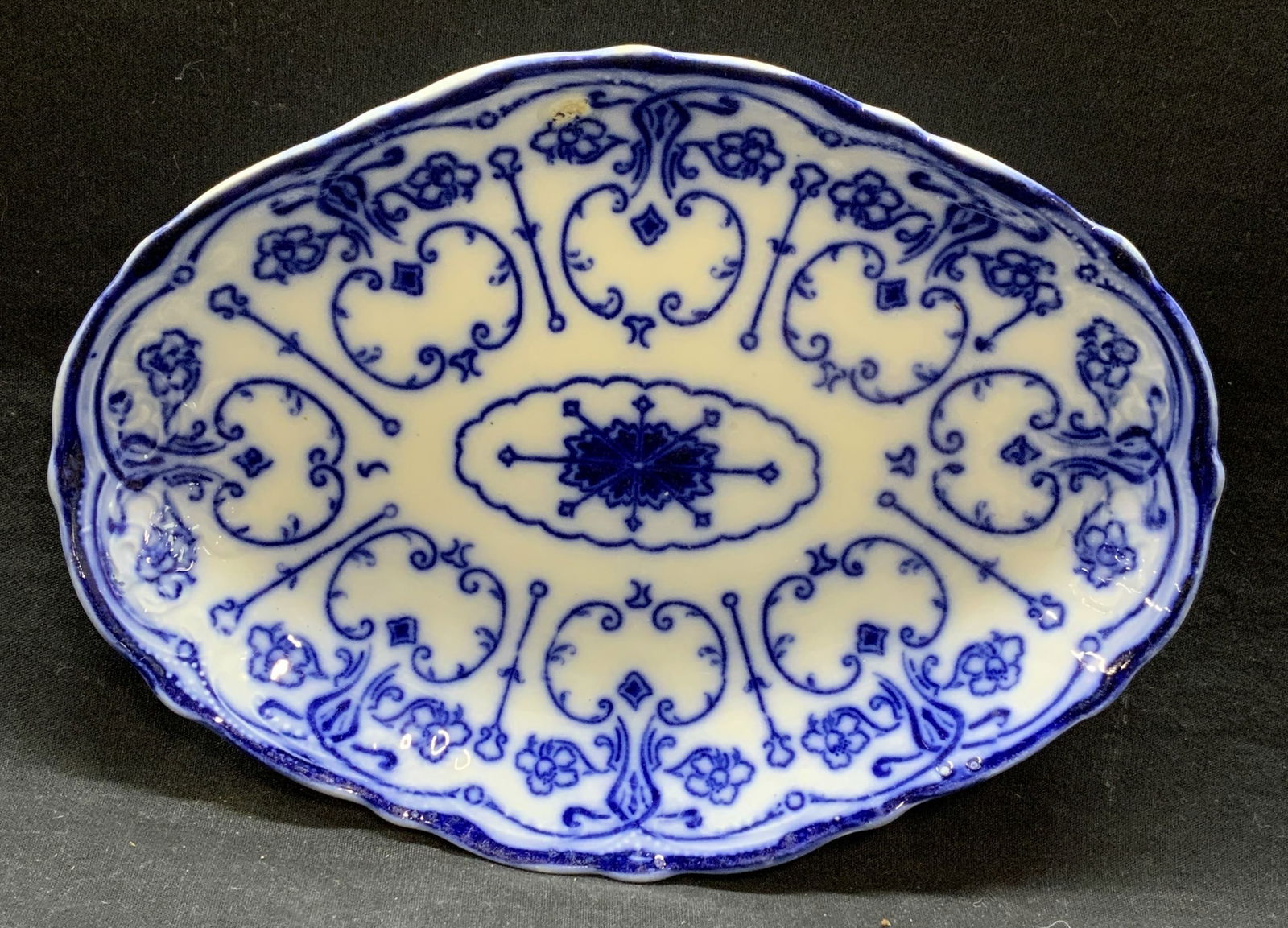 Antique Wharf Pottery Semi Porcelain Platter Eng: Antique New Wharf Pottery Conway blue flow pattern semi porcelain platter. Made in England. Trademarked to underside. Some surface wear including chipping observed. Measures approx. 10.5 x 7.75 inches